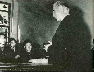 Japanese students listen attentively as Father Walsh teaches in a Tokyo high school